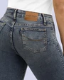 Jeans levanta pompa tiro alto con un botón estilo recto 461 azul claro